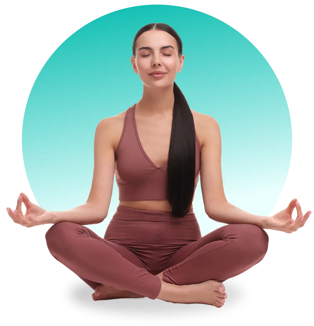 Woman meditating cross-legged in mauve yoga set